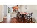 Dining area with four chairs and view of kitchen at 3406 Waterbridge Dr, Tampa, FL 33618