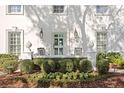 Elegant front porch with light-blue door and manicured hedges at 4811 Culbreath Isles Rd, Tampa, FL 33629