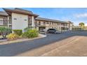 Exterior view of condo building with parking and landscaping at 5197 Silent Loop # 224, New Port Richey, FL 34652