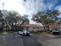 Exterior view of condo community with a car parked at 562 Andorra Ne Cir # 562, St Petersburg, FL 33703