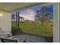 Ground level patio with seating area overlooking a golf course at 6085 Bahia Del Mar Blvd # 105, St Petersburg, FL 33715