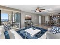 Open concept living room and dining area with water views at 6322 Palma Del Mar S Blvd # 1001, St Petersburg, FL 33715