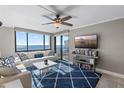 Bright living room with water views, comfy seating, and stylish decor at 6322 Palma Del Mar S Blvd # 1001, St Petersburg, FL 33715