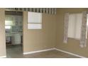 Living room with kitchen access and tiled floor at 6720 Hibiscus S Ave, South Pasadena, FL 33707