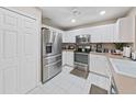 Modern kitchen with stainless steel appliances and white cabinets at 8229 Eagles Park N Dr, St Petersburg, FL 33709