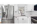 Stainless steel appliances and white shaker cabinets at 11119 N 21St St, Tampa, FL 33612