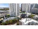 Aerial view of the towers showing the building's architecture, pool, and surrounding greenery at 1209 E Cumberland Ave # 505, Tampa, FL 33602