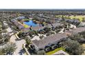 Aerial view of a residential community with houses and lush greenery at 14935 Skip Jack Loop # 106, Lakewood Ranch, FL 34202