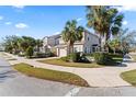 Two-story house with white shutters and a palm tree-lined street at 14935 Skip Jack Loop # 106, Lakewood Ranch, FL 34202