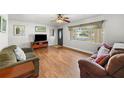 Bright living room featuring hardwood floors and ample natural light at 1720 Hampton Ln, Clearwater, FL 33756