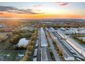 Aerial view of condo building near a pond at sunset at 1950 58Th N Ave # 9, St Petersburg, FL 33714