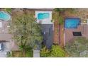 Aerial view showing house, pool, and surrounding homes at 2826 Kavalier Dr, Palm Harbor, FL 34684