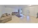 Living room with tile flooring and arched window at 305 Crayford Pl, Valrico, FL 33594