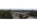 Wide aerial view of neighborhood with city skyline in background at 3101 E 23Rd Ave, Tampa, FL 33605