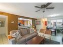 Bright living room with adjacent kitchen and dining areas at 3710 41St S Way # C, St Petersburg, FL 33711