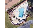 Community pool and surrounding recreational areas are shown from an aerial perspective at 407 Lake Point Ct # 4E, Sun City Center, FL 33573