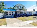 Newly painted home with a landscaped front yard at 4099 30Th N St, St Petersburg, FL 33714