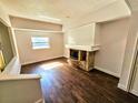 Bright living room with fireplace and hardwood floors at 4405 W Fair Oaks Ave # 10, Tampa, FL 33611