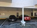 Covered parking area with two cars parked at 4405 W Fair Oaks Ave # 10, Tampa, FL 33611