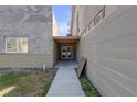 Side entrance with covered walkway leading to double doors at 4408 W Leona St, Tampa, FL 33629