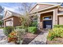 House exterior with a walkway and landscaping at 6003 Tealside Ct, Lithia, FL 33547