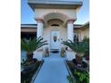 Welcoming entryway with columns, potted plants, and decorative lion statues at 6190 107Th N Ave, Pinellas Park, FL 33782