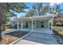 Newly renovated home with covered porch and landscaped yard at 6629 Travis Blvd, Tampa, FL 33610