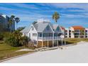 Beachfront property aerial view, showing a two-story house under renovation at 887 S Gulfview Blvd, Clearwater Beach, FL 33767