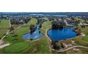 Picturesque view of a meticulously maintained golf course, surrounded by lush greenery and tranquil waters at 8950 Park Blvd # 406, Seminole, FL 33777