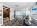 Building hallway with elevator access and seating area at 134 Mariner Dr # 134, Tarpon Springs, FL 34689