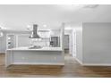 Modern kitchen features stainless steel appliances and a large island at 1399 Grapeleaf Ct, Tarpon Springs, FL 34689