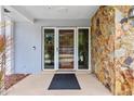 Inviting front entrance with stone accents and glass door at 1903 Oro Ct, Clearwater, FL 33764