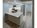 Modern kitchen with stainless steel appliances and granite countertops at 19505 Quesada Ave # O105, Port Charlotte, FL 33948