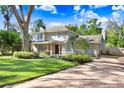 Two-story house with a landscaped yard and brick driveway at 2752 Buckhorn Oaks Dr, Valrico, FL 33594