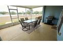 Screened patio with outdoor furniture and grill at 1552 Blue Magnolia Rd, Brandon, FL 33510
