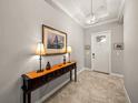 Bright and spacious entryway with a console table and elegant lighting at 16959 Scuba Crest St, Wimauma, FL 33598