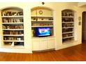 Living room features built-in shelving and hardwood floors at 18108 Sugar Brooke Dr, Tampa, FL 33647