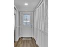 Hallway with coat closets and stained glass door at 2351 Irish Ln # 21, Clearwater, FL 33763