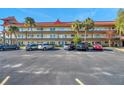 Condo building showcasing its architecture and parking lot at 2402 Ecuadorian Way # 28, Clearwater, FL 33763