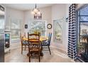 Charming breakfast nook with farmhouse table and black and white checkered decor at 29526 Tee Shot Dr, San Antonio, FL 33576