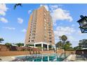 High-rise building with pool and lush landscaping at 4015 Bayshore Blvd # 9D, Tampa, FL 33611