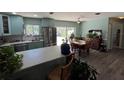 Modern kitchen boasting stainless steel appliances and light-colored cabinets at 5730 16Th Ne Ln, St Petersburg, FL 33703