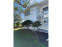 Side view of condo building showcasing landscaping and building exterior at 5895 18Th N St # 9, St Petersburg, FL 33714