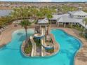 Resort-style pool with a waterslide and surrounding lounge area at 5936 Golden Nettle Dr, Apollo Beach, FL 33572