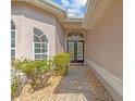 Front entrance with double doors and a brick walkway at 805 Anchors Way, Tarpon Springs, FL 34689