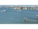Stunning water view featuring a private dock and boats sailing in the distance at 100 Bluff View Dr # 401A, Belleair Bluffs, FL 33770