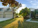 House exterior showcasing the front entrance and side at 11016 Holly Cone Dr, Riverview, FL 33569