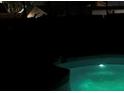 Illuminated pool at night at 3602 Cambridge W Dr, Bradenton, FL 34205