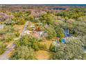 Property view showcasing home, pool, and large lot at 3704 Berger Rd, Lutz, FL 33548