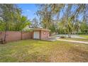 Spacious backyard with detached garage and sports court at 3704 Berger Rd, Lutz, FL 33548